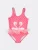 Слитный купальник розового цвета с юбочкой из сетки для девочек